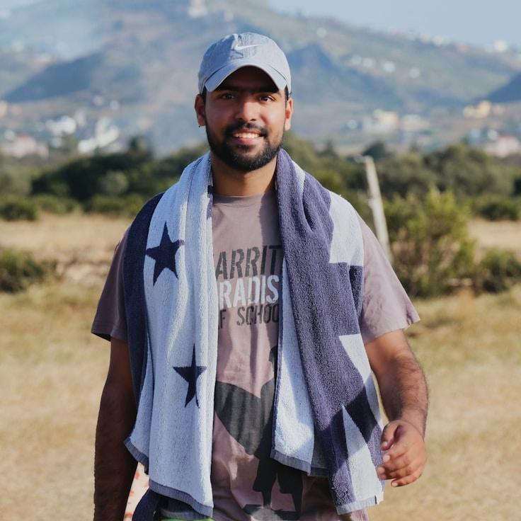 Kaveri Mehta, Lead Design Curator at GardenFieldHaven, reviewing corporate floral arrangements